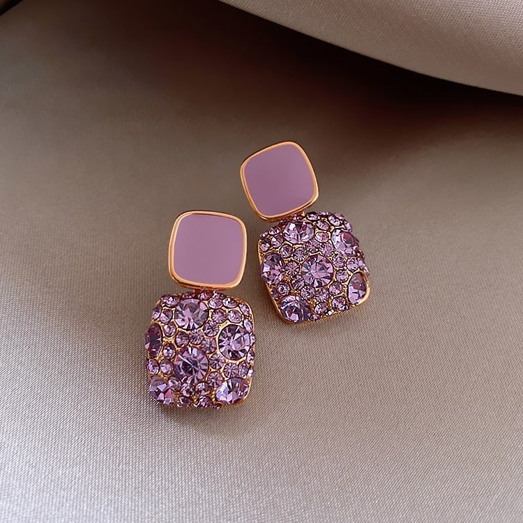Orecchini di lusso viola con incrustazione di zirconio