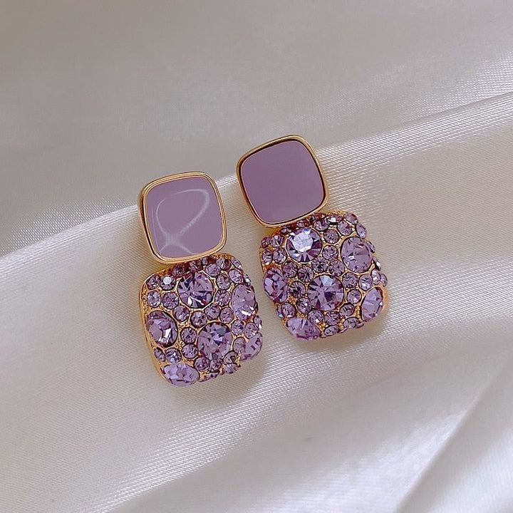 Orecchini di lusso viola con incrustazione di zirconio